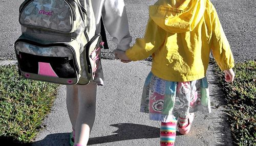 sisters holding hands