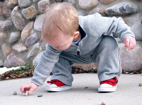 toddler boy with rocks