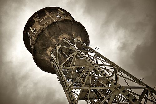 A dramatic photo of a water tower.