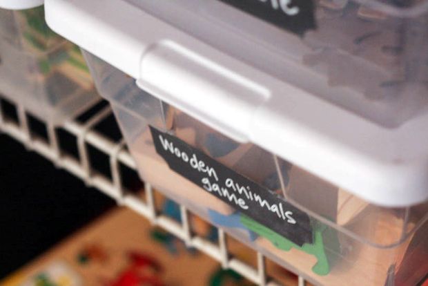 Add chalkboard labels to plastic boxes for reusable toy containers.