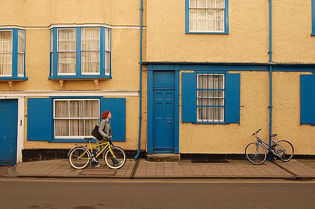 woman walking a bike