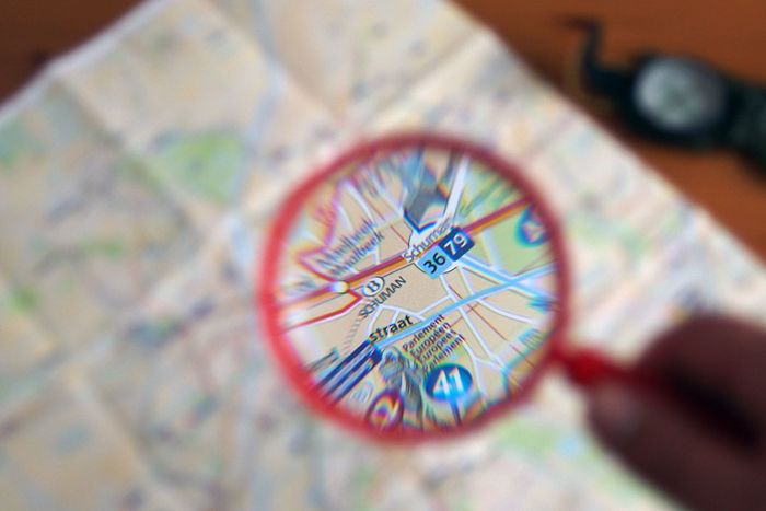 Map and magnifying glass